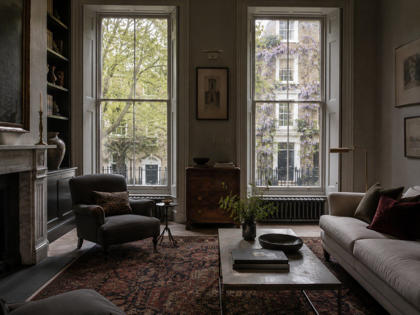 Sitting room in Mayfair with tall sash windows and a leafy street beyond